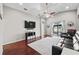 Open-concept living room with stylish decor, wood floors, and access to the backyard at 5707 Fischer Dr, Lakeland, FL 33812