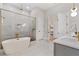 Stunning bathroom with a soaking tub, walk-in shower, and sleek finishes at 5762 Emerington Cres, Orlando, FL 32819