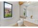 Modern bathroom with a floating vanity, sleek toilet, and natural light at 5762 Emerington Cres, Orlando, FL 32819