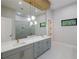Modern bathroom featuring double sinks, white countertops, and modern fixtures at 5762 Emerington Cres, Orlando, FL 32819