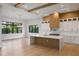 Contemporary kitchen featuring a center island, white cabinets and wood accents at 5762 Emerington Cres, Orlando, FL 32819