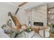 Elegant living room boasts a marble fireplace, hardwood floors, a stylish staircase, and comfortable seating for relaxation at 5762 Emerington Cres, Orlando, FL 32819