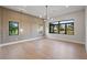 Sunlit Living room boasts decorative trim and a wall of windows at 5762 Emerington Cres, Orlando, FL 32819