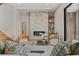 Serene living room featuring a marble fireplace, hardwood floors, stylish decor, and ample natural light throughout the space at 5762 Emerington Cres, Orlando, FL 32819