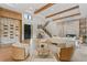 Spacious living room with hardwood floors, a modern staircase, marble fireplace, and comfortable seating for entertaining guests at 5762 Emerington Cres, Orlando, FL 32819