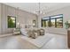 Spacious main bedroom with large windows and seating area at 5762 Emerington Cres, Orlando, FL 32819