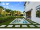 Backyard swimming pool with well-maintained turf and stepping stone pavers at 5762 Emerington Cres, Orlando, FL 32819