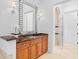Bright bathroom with a modern vanity, large mirror and glass-enclosed shower at 6143 Cartmel Ln, Windermere, FL 34786