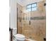 Bathroom featuring glass shower, tile, and updated fixtures at 6143 Cartmel Ln, Windermere, FL 34786