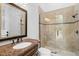 Bathroom showcasing marble vanity, glass shower, and stylish fixtures at 6143 Cartmel Ln, Windermere, FL 34786