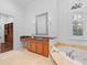 Luxurious bathroom with a soaking tub, a vanity, and a walk-in closet at 6143 Cartmel Ln, Windermere, FL 34786