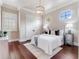 Serene bedroom featuring a plush bed, side tables, and elegant decor, creating a relaxing retreat at 6143 Cartmel Ln, Windermere, FL 34786