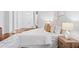 Bedroom with hardwood floors, neutral decor, and a large bed at 6143 Cartmel Ln, Windermere, FL 34786