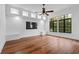 Spacious bonus room offers recessed lighting, wood floors, and large windows with backyard views at 6143 Cartmel Ln, Windermere, FL 34786