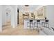 Kitchen with breakfast bar seating, elegant cabinetry, and open transition to the home's living areas at 6143 Cartmel Ln, Windermere, FL 34786