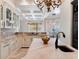 Open concept kitchen featuring granite countertops, tile backsplash, and stainless steel faucet at 6143 Cartmel Ln, Windermere, FL 34786