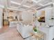 Open-concept living area showcases a coffered ceiling, chandelier, and seamless flow into the adjacent kitchen at 6143 Cartmel Ln, Windermere, FL 34786