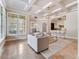 Spacious living area featuring a blend of elegant lighting, open flow and large windows with plantation shutters at 6143 Cartmel Ln, Windermere, FL 34786