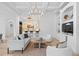 Open concept living area showcases coffered ceilings, neutral palette, and seamless flow to the kitchen at 6143 Cartmel Ln, Windermere, FL 34786