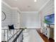 Stylish loft space with wallpaper and seating area, perfect for relaxing or entertaining guests at 6143 Cartmel Ln, Windermere, FL 34786