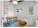 Bright home office with natural light, wood beams, and a comfortable seating area at 6143 Cartmel Ln, Windermere, FL 34786