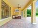 Outdoor kitchen and patio with a grill, mini-fridge, and spacious seating, ideal for entertaining at 6143 Cartmel Ln, Windermere, FL 34786