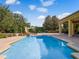 Beautiful backyard pool featuring a slide, and spacious seating perfect for outdoor entertainment at 6143 Cartmel Ln, Windermere, FL 34786