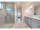 Bathroom with a glass-enclosed shower and a dual vanity at 6667 Alder Rd, Harmony, FL 34773