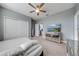 Well-lit bedroom with carpet, storage, and media console at 6667 Alder Rd, Harmony, FL 34773