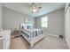 Comfortable bedroom with carpet, a ceiling fan, and a window for natural light at 6667 Alder Rd, Harmony, FL 34773