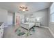 Light and airy main bedroom with a ceiling fan and a rug with floral motif at 6667 Alder Rd, Harmony, FL 34773