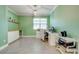 Bright home office with built-in storage, natural light, and a neutral color scheme at 6667 Alder Rd, Harmony, FL 34773