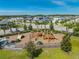 Community playground with modern play equipment, picnic tables, and surrounded by lush landscaping at 6667 Alder Rd, Harmony, FL 34773