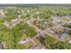 Aerial view showcasing the home's location within a tree-lined neighborhood at 825 Second St, Orange City, FL 32763
