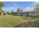 Spacious backyard featuring a shed and plenty of green space perfect for outdoor activities and gardening at 825 Second St, Orange City, FL 32763