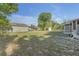 Expansive backyard with storage shed, partially fenced, and ready for customization at 825 Second St, Orange City, FL 32763