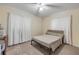 Simple bedroom with carpeted floors and minimal furniture under bright lighting at 825 Second St, Orange City, FL 32763