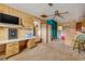 A finished bonus room with built-in workspace and access to the kitchen at 825 Second St, Orange City, FL 32763