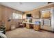 Large bonus room with built-in desk, cabinetry, and carpeted flooring at 825 Second St, Orange City, FL 32763