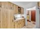 Functional kitchen featuring light wood cabinetry, tiled flooring and a bright countertop at 825 Second St, Orange City, FL 32763