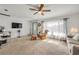 Inviting living room featuring a whitewashed brick wall, large window, and cozy seating area at 825 Second St, Orange City, FL 32763