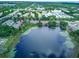 Beautiful overhead view of townhomes near lake, offering scenic views and a serene environment at 8419 Chamberlain Pl, Oviedo, FL 32765