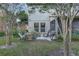 Relaxing backyard patio features a hammock, grill, and peaceful seating area, perfect for outdoor enjoyment at 8419 Chamberlain Pl, Oviedo, FL 32765