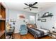 Cozy bedroom with hardwood floors, soft lighting, and a comfortable bed at 8419 Chamberlain Pl, Oviedo, FL 32765