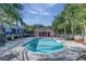 Community pool with plenty of lounge chairs and a pool house at 8419 Chamberlain Pl, Oviedo, FL 32765