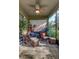 Comfortable screened porch with cozy seating, plants, and charming decor, perfect for relaxing at 8419 Chamberlain Pl, Oviedo, FL 32765