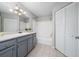 Bathroom with a shower-tub combination, white tiling and a gray vanity at 8997 Lee Vista Blvd # 2009, Orlando, FL 32829