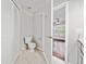 Bathroom with a toilet next to a closet at 8997 Lee Vista Blvd # 2009, Orlando, FL 32829