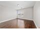 Spacious bedroom with a large window and hardwood floors at 8997 Lee Vista Blvd # 2009, Orlando, FL 32829