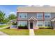 Attractive townhome with covered front porch, neat landscaping and sidewalks at 8997 Lee Vista Blvd # 2009, Orlando, FL 32829
